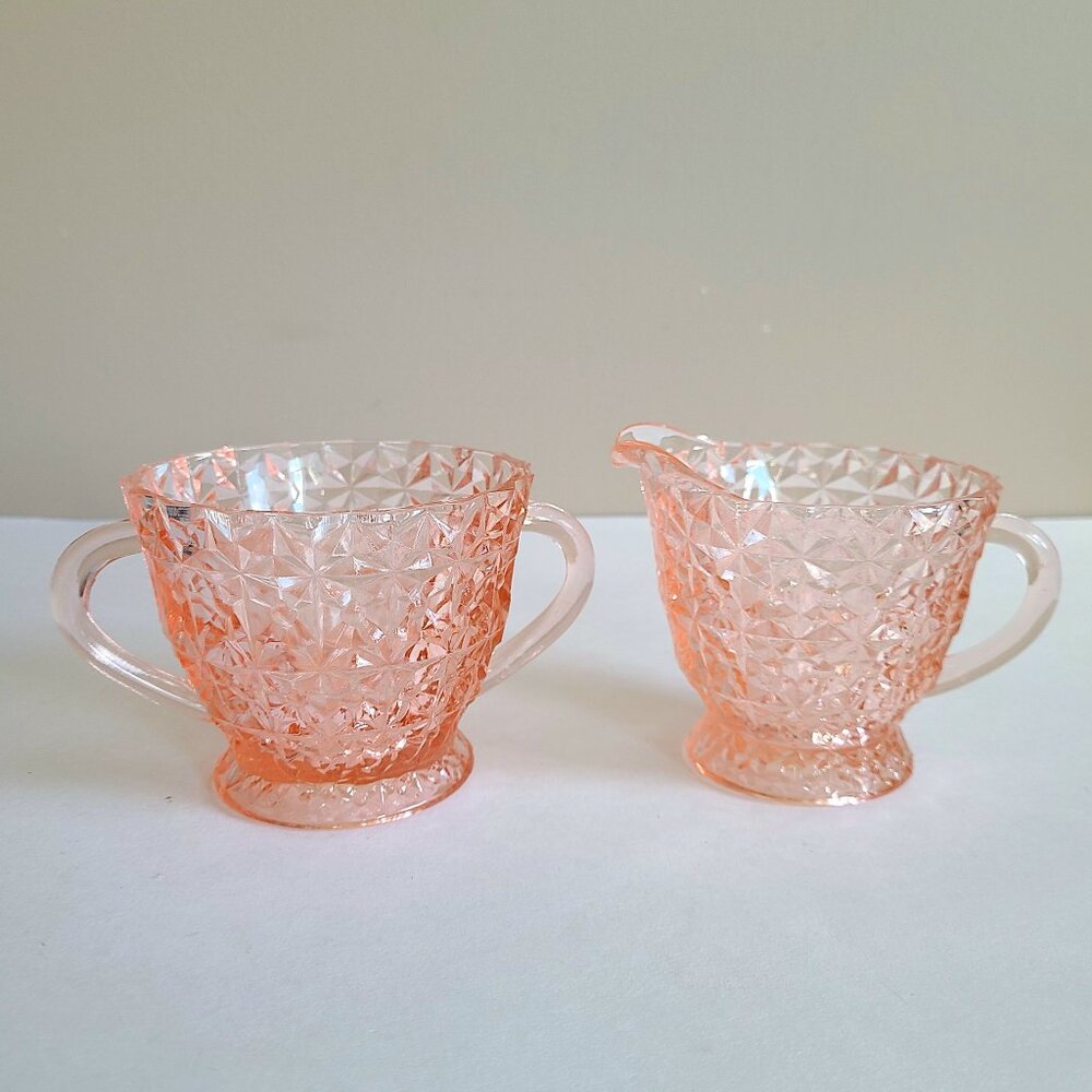Jeannette Holiday pattern depression pink glass creamer and sugar bowl.